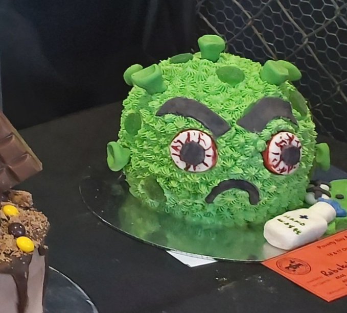 COVID angry-face cake from Turanga-nui-a-Kiwi in New Zealand