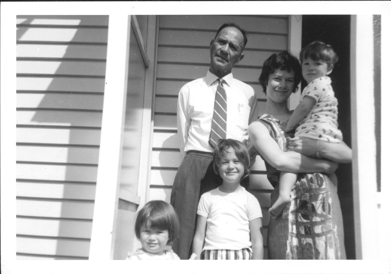 My mum as a child [centre], uncle [left] and grandmother along with my great grandfather, Auckland early 60's - B&W