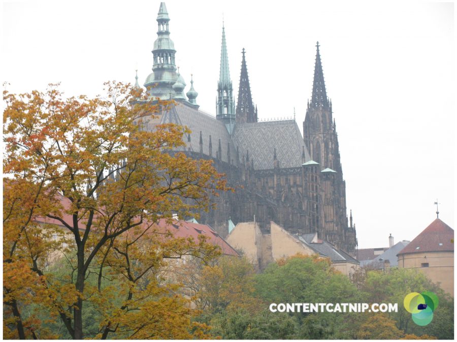 A cathedral roof and autumnal trees in Prague. Copyright Content Catnip 2009