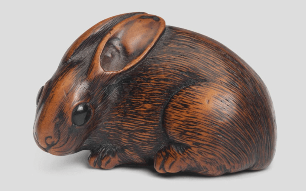 A wood netsuke of a lunar hare, from the  Edo period (19th century).  