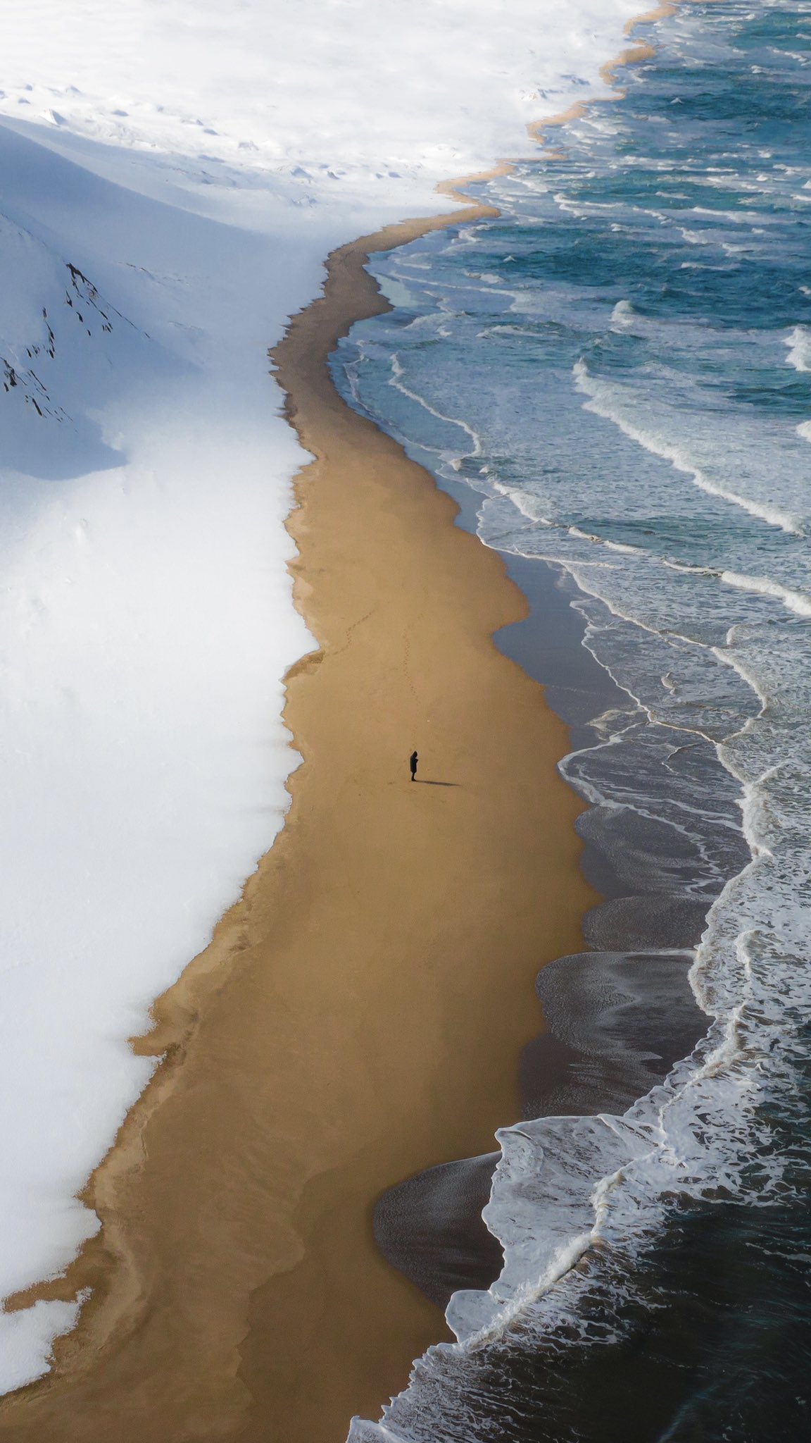 Snow along a lonely stretch of coast of Tottori prefecture, Japan