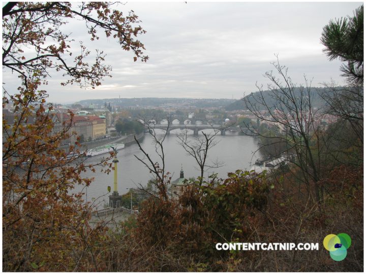 Looking towards the atmospheric Charles Bridge in Prague as the autumn leaves tumble down. Copyright Content Catnip 2009.