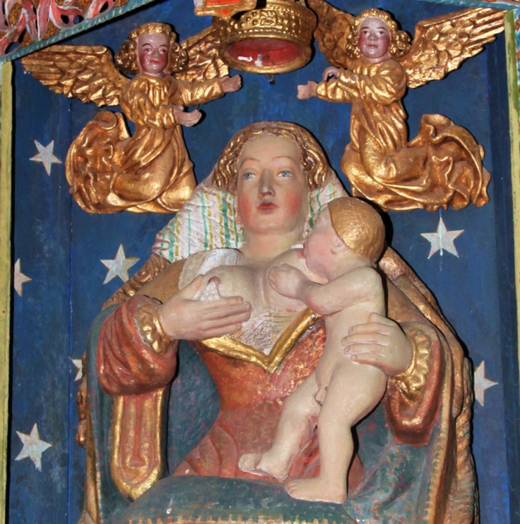 The church in Lanrivain contains a rather charming carved wooden statue depicting a reclining Virgin breast-feeding