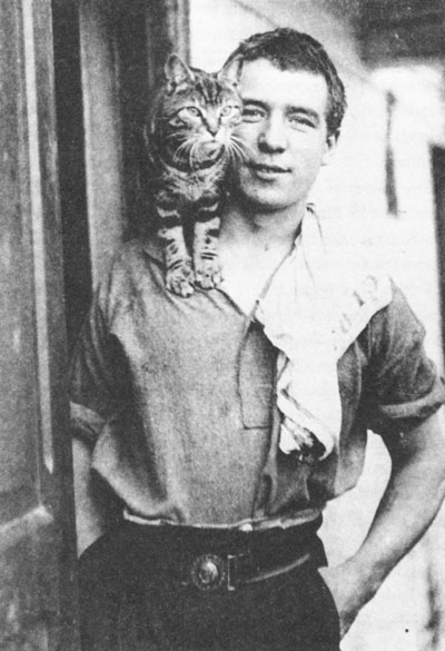 Perce Blackborow (age 18) with Mrs. Chippy, ship’s cat, on board the Endurance; photo by Frank Hurley, 1914