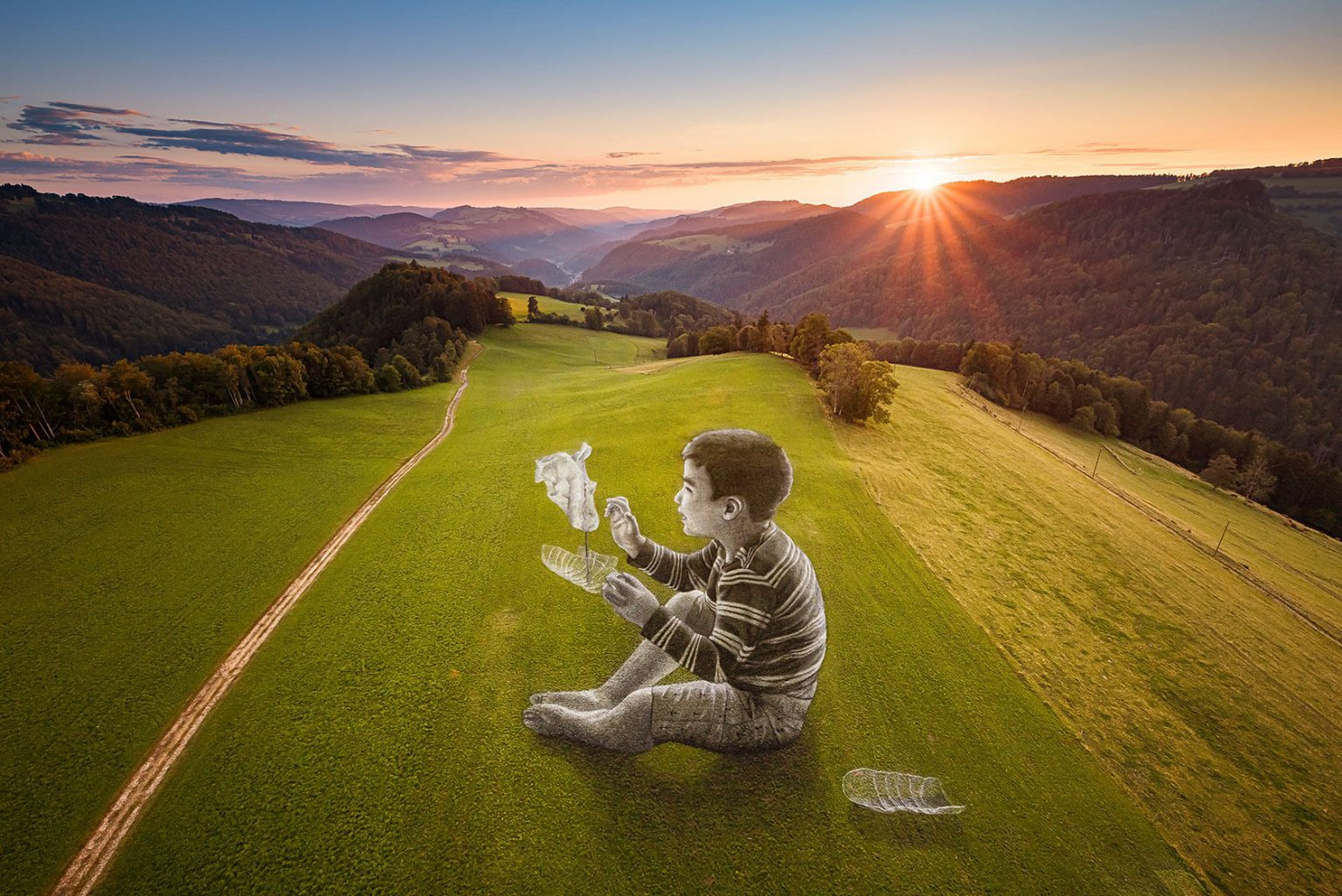 Gargantuan children on top of mountains by street artist Saype 