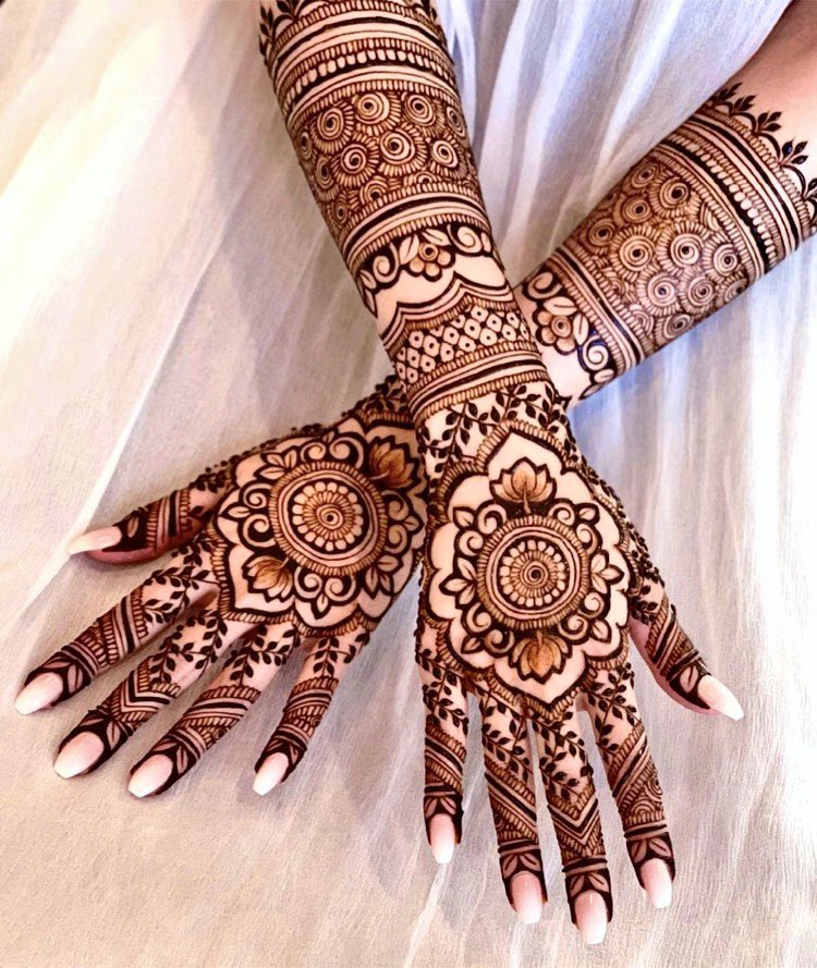 A collection of ornate and exquisite henna paintings on hands