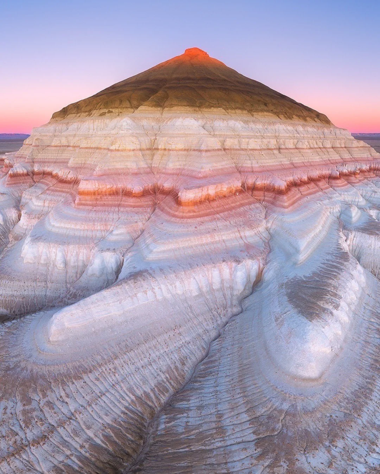 Remnants of the pehistoric Tethys ocean in layer cake formation - Bokty mountain, Kazakhstan. Comforting thought