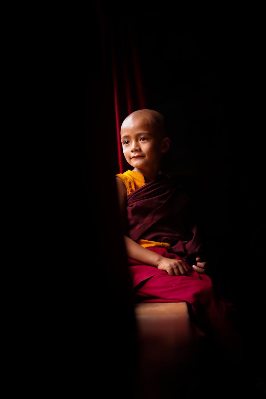 Boy in Buddhist Robes. Photo by Abhieshek Shivdas